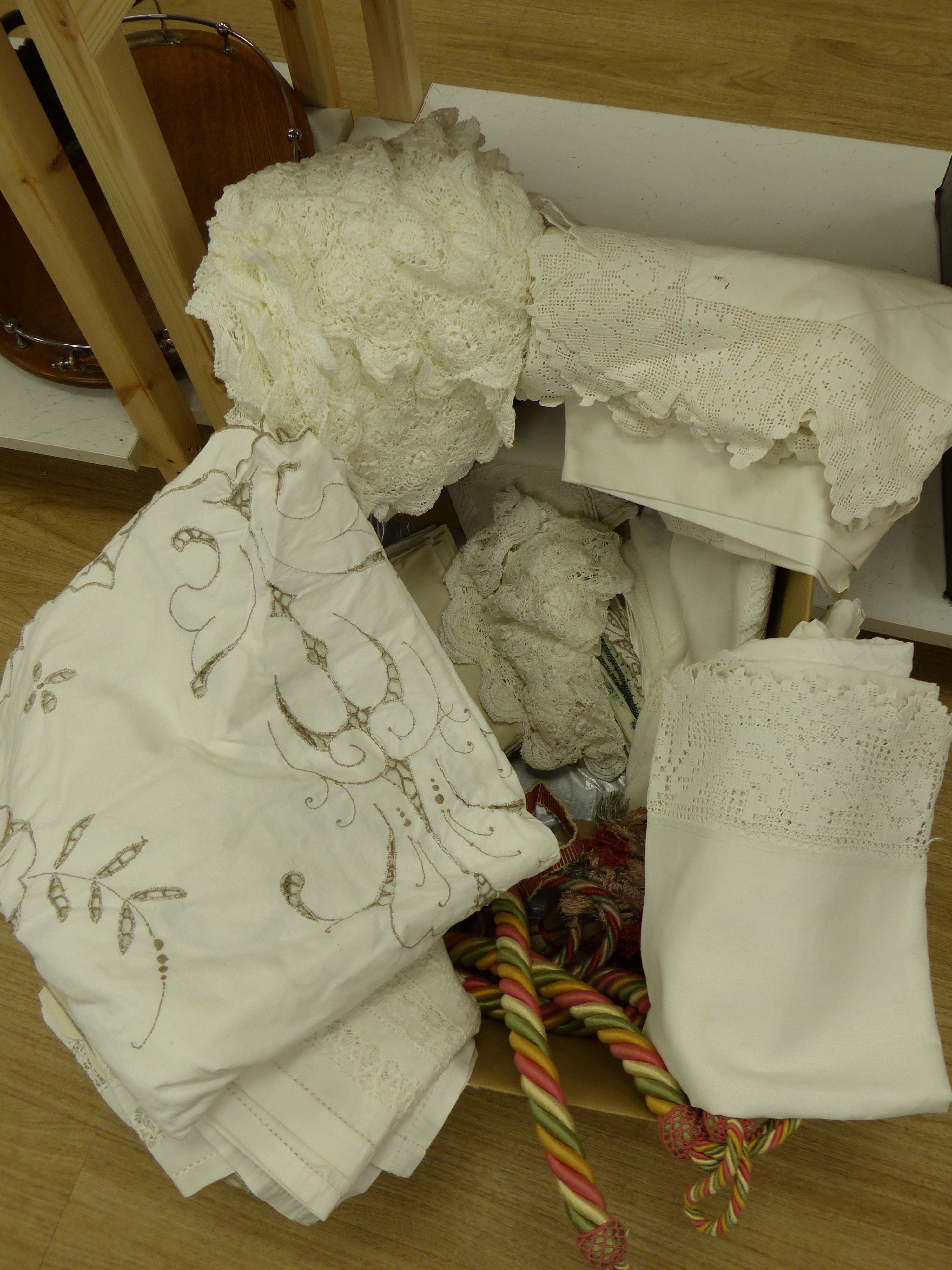 A quantity of table linen and a pair of rope tiebacks